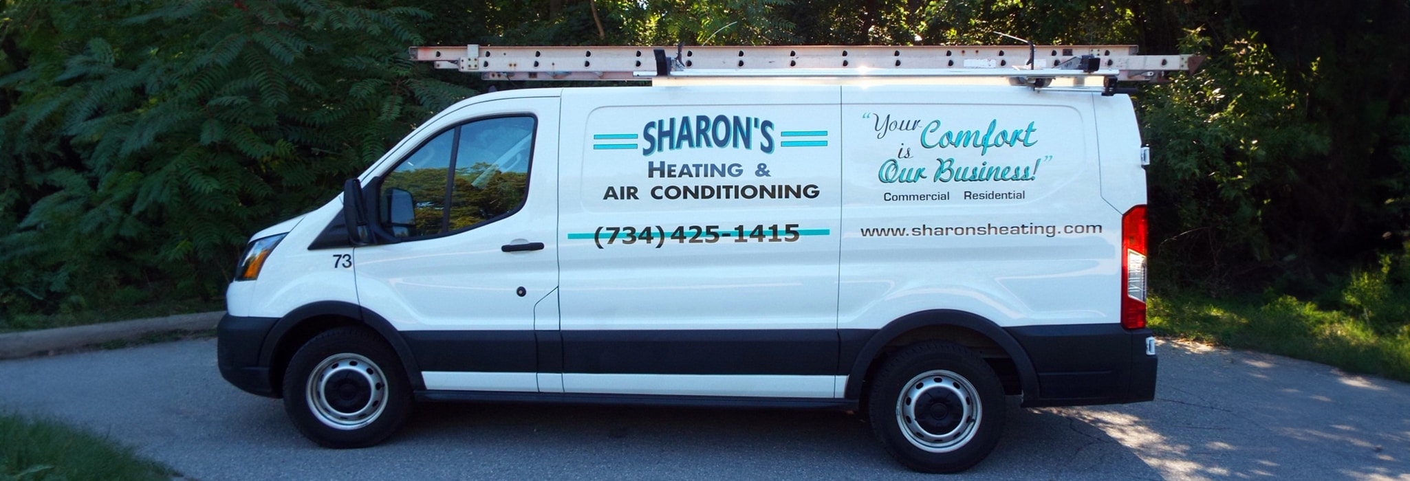 Sharon's Heating & Air Conditioning service truck outside.